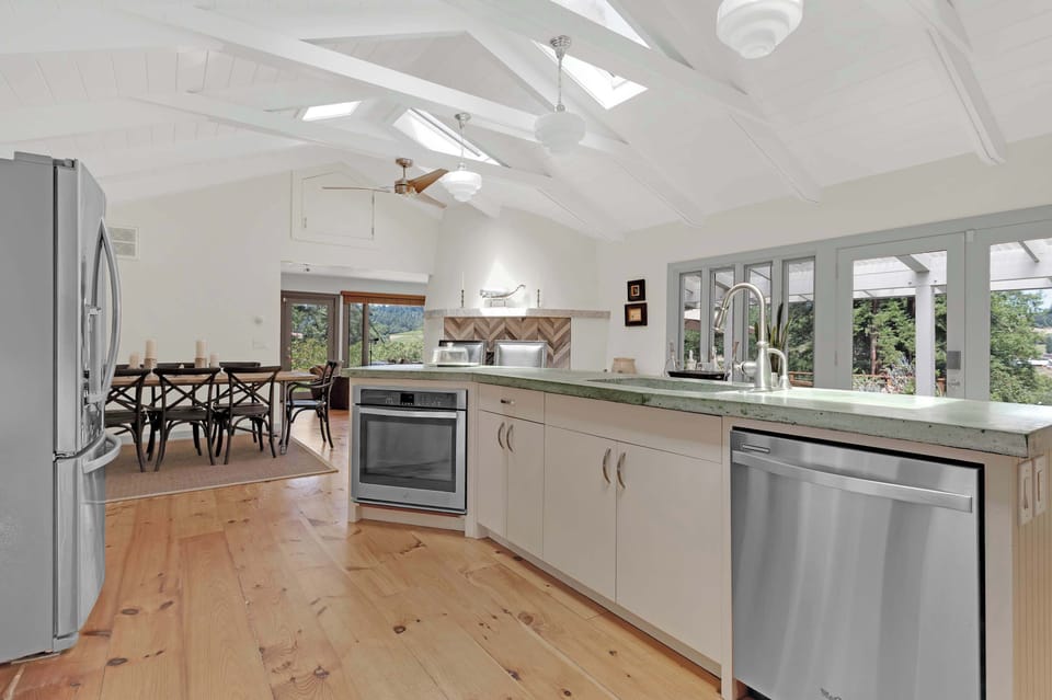 This bright and spacious kitchen is designed for effortless entertaining and culinary creation. Its open-concept layout ensures you're always part of the conversation.