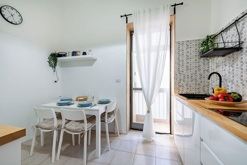 Family Apartment, Multiple Bedrooms (Eva Apartment Bari) | Private kitchen | Fridge, microwave, stovetop, coffee/tea maker