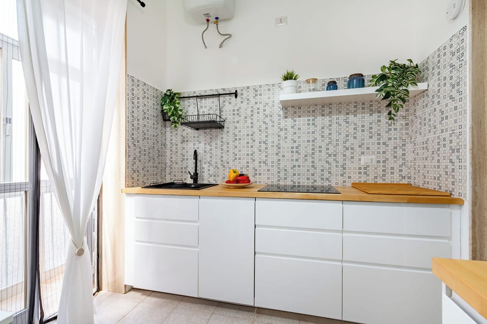 Family Apartment, Multiple Bedrooms (Eva Apartment Bari) | Private kitchen | Fridge, microwave, stovetop, coffee/tea maker