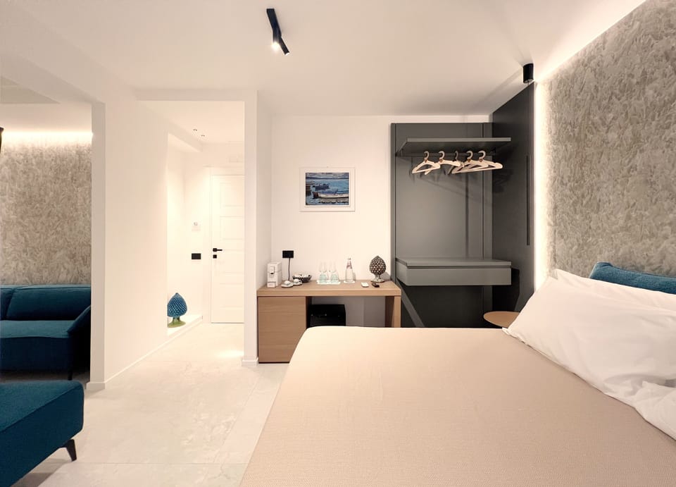 Deluxe Suite, Balcony | Minibar, desk, laptop workspace, soundproofing