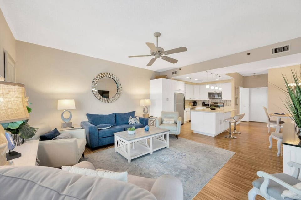 Spacious open Living room with sliding glass doors to the balcony.
