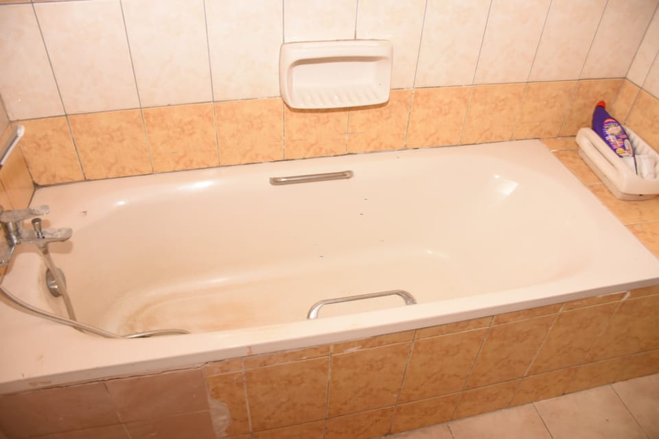 Family Suite, Garden View | Bathroom | Towels, soap, toilet paper