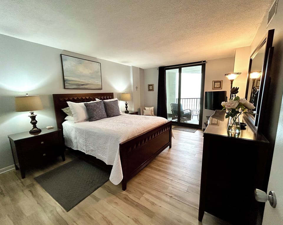 Primary Bedroom w/ private balcony access