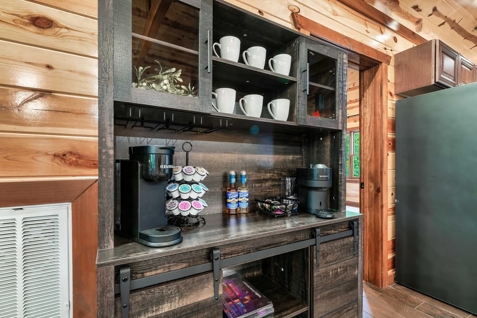 rustic coffee station with keurig and nespresso machines and mugs
