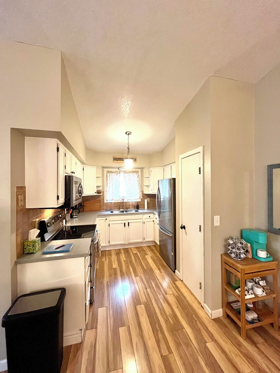 Kitchen area with coffee bar.
