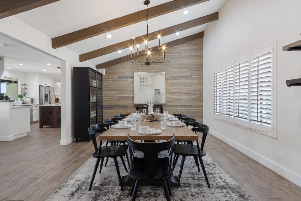 Dining Room: Elegant space with high wood-beamed ceilings