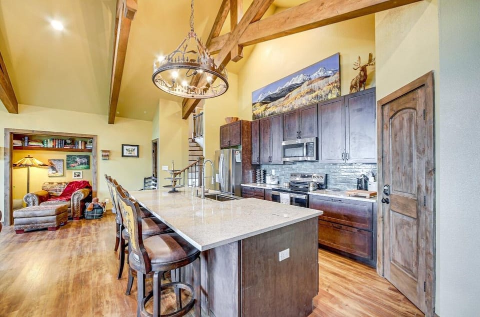 The large kitchen island provides additional meal seating for 4 guests. 