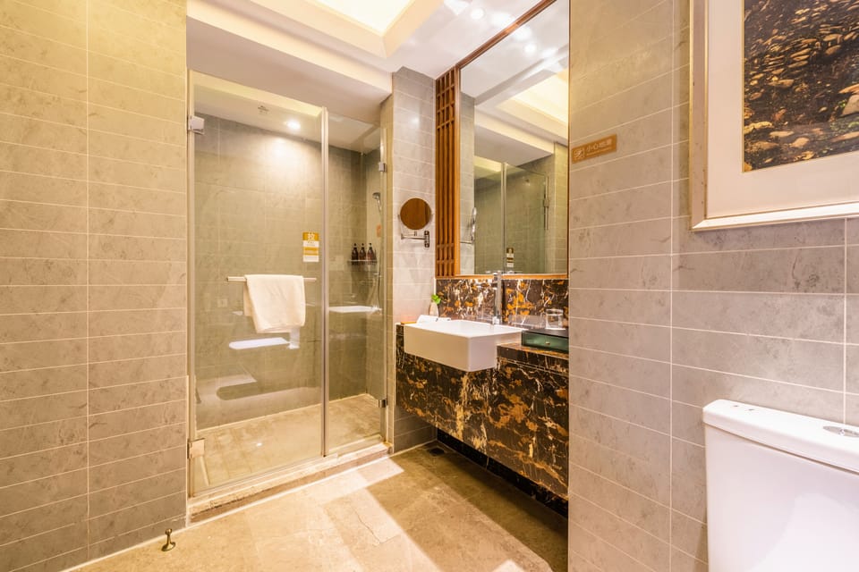 Shower, free toiletries, hair dryer, slippers