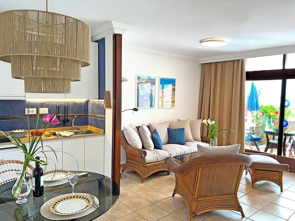 Apartment, 1 Bedroom (Balcony or Terrace) | Living area | 50-inch flat-screen TV with digital channels, TV