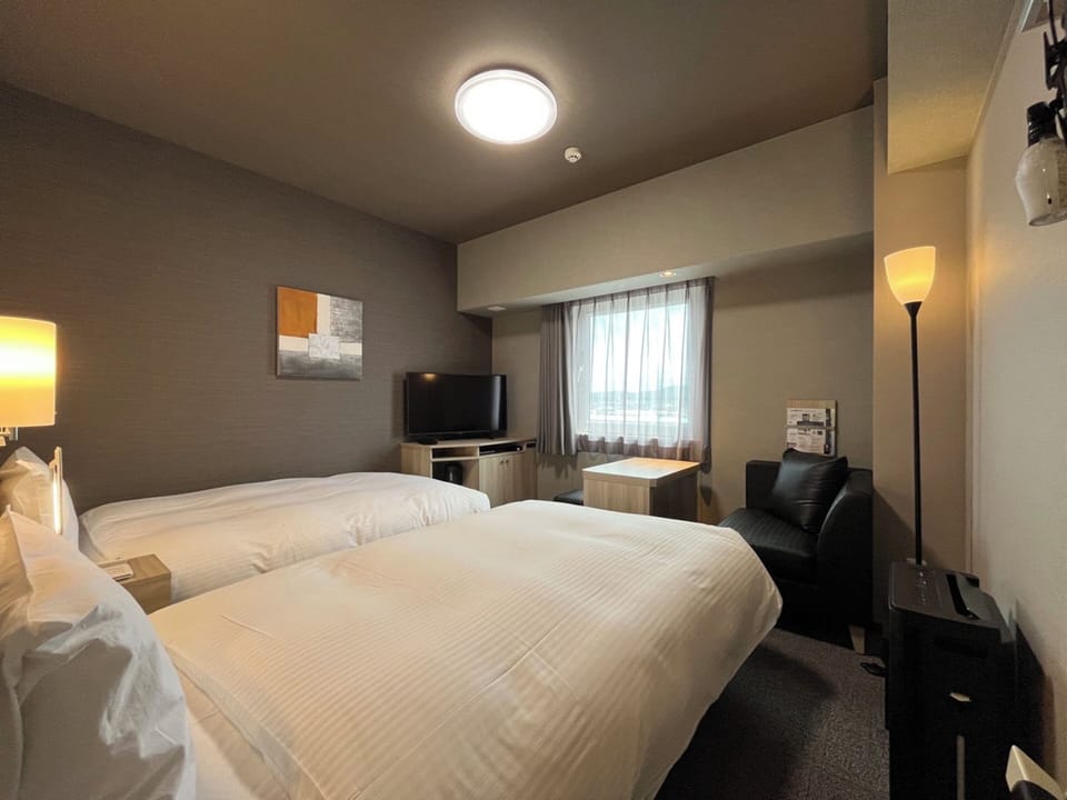 Twin Room, Non Smoking | Desk, laptop workspace, blackout drapes, iron/ironing board (on request)