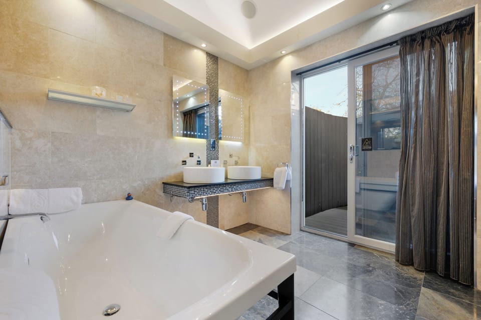 Designer toiletries, hair dryer, towels, soap