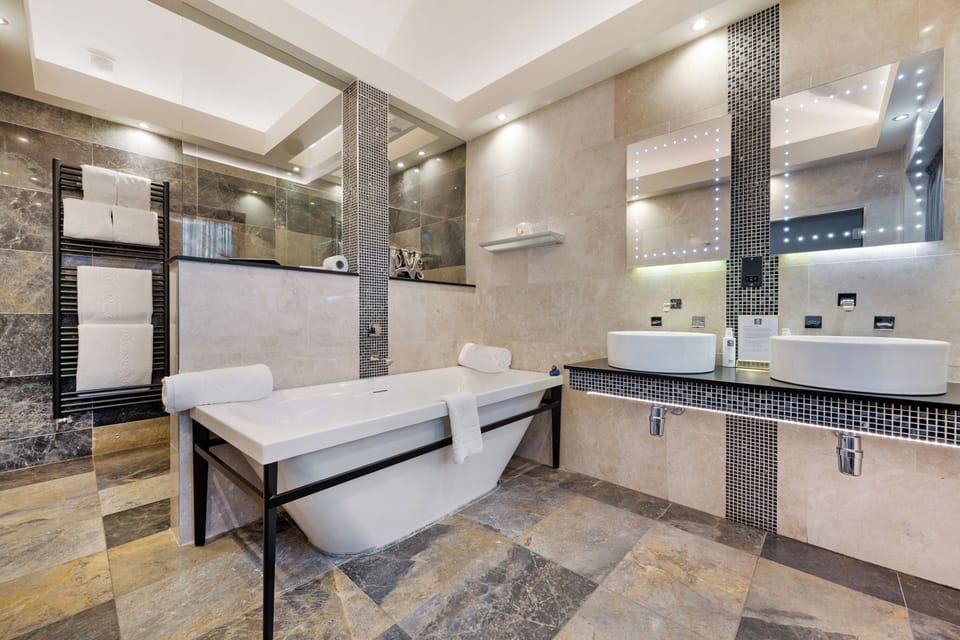 Designer toiletries, hair dryer, towels, soap