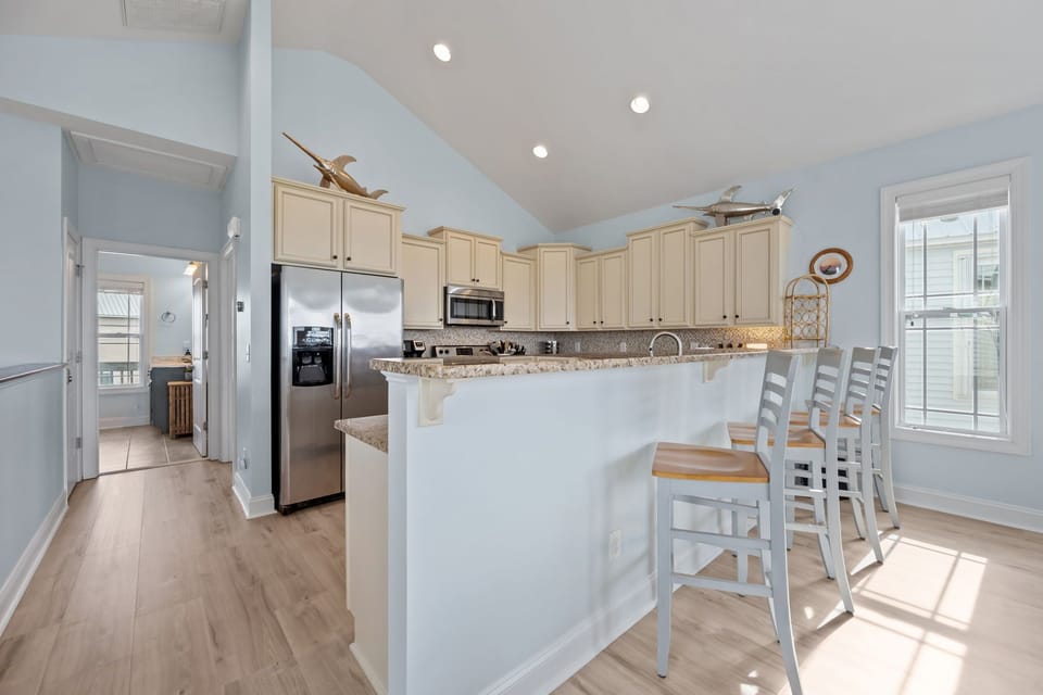 Serve up drinks or casual dining at the granite bar top