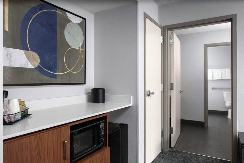 Suite, 1 Bedroom | Laptop workspace, blackout drapes, iron/ironing board