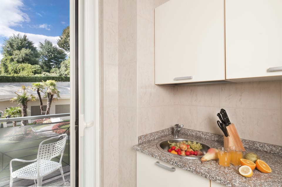 Two-Room Apartment (3/4 Persons) with 1 sofa bed, mountain side | Private kitchen | Full-size fridge, microwave, stovetop, coffee/tea maker