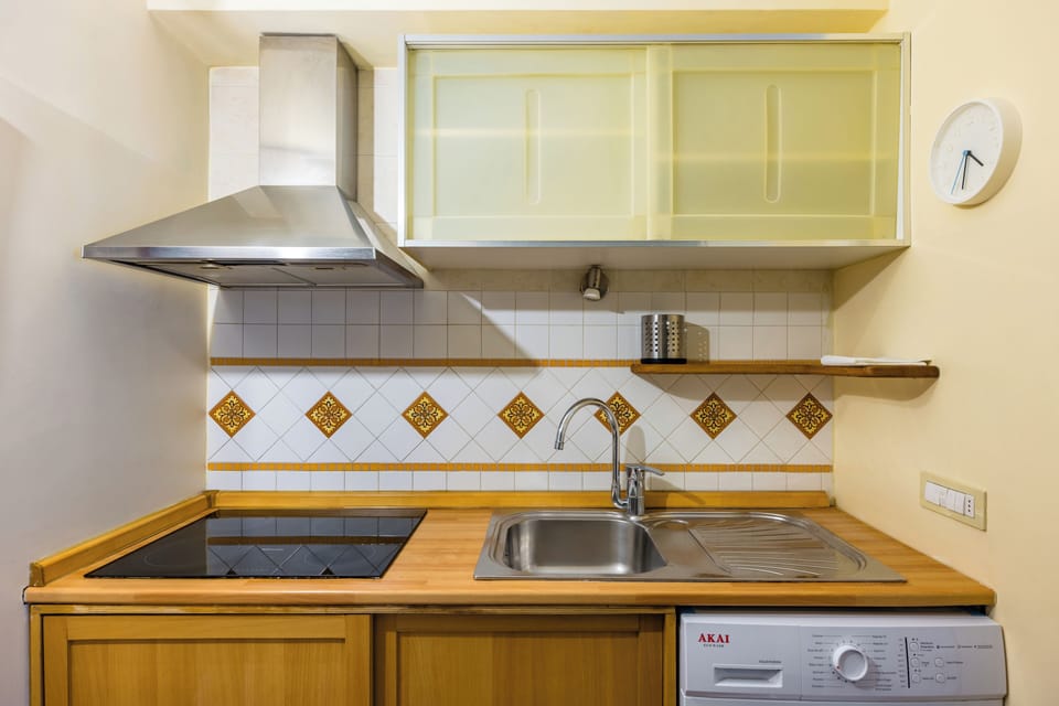 Apartment (1 Bedroom) | Private kitchen | Stovetop, espresso maker, electric kettle, cookware/dishes/utensils