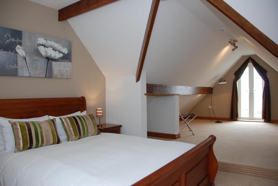 Premium bedding, desk, laptop workspace, soundproofing