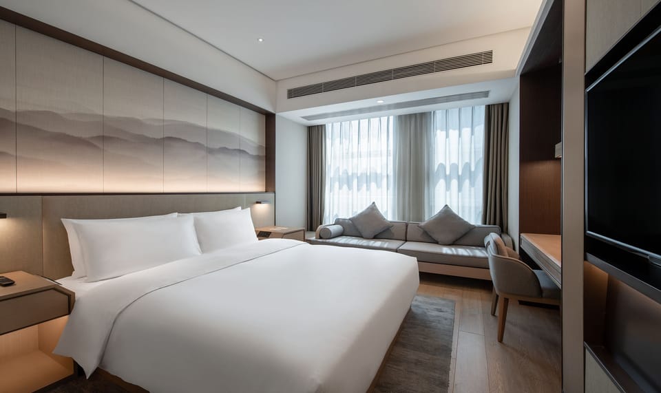 Basic Double Room, 1 Queen Bed, Air conditioning, City View | In-room safe, desk, laptop workspace, blackout drapes