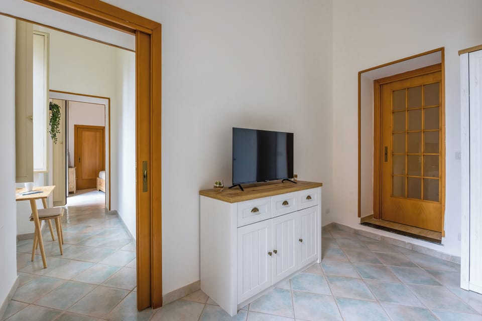 Apartment (2 Bedrooms) | Living area | 32-inch Smart TV with cable channels