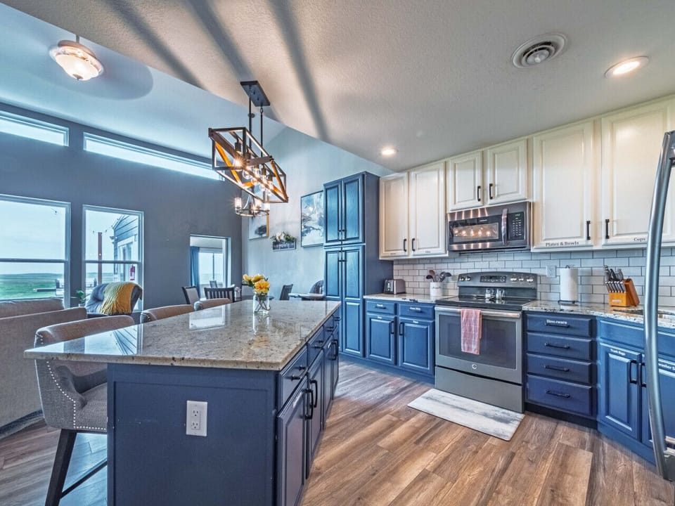 Experience seamless entertaining with a spacious dining room bathed in natural light, complemented by a contemporary, well-appointed kitchen.