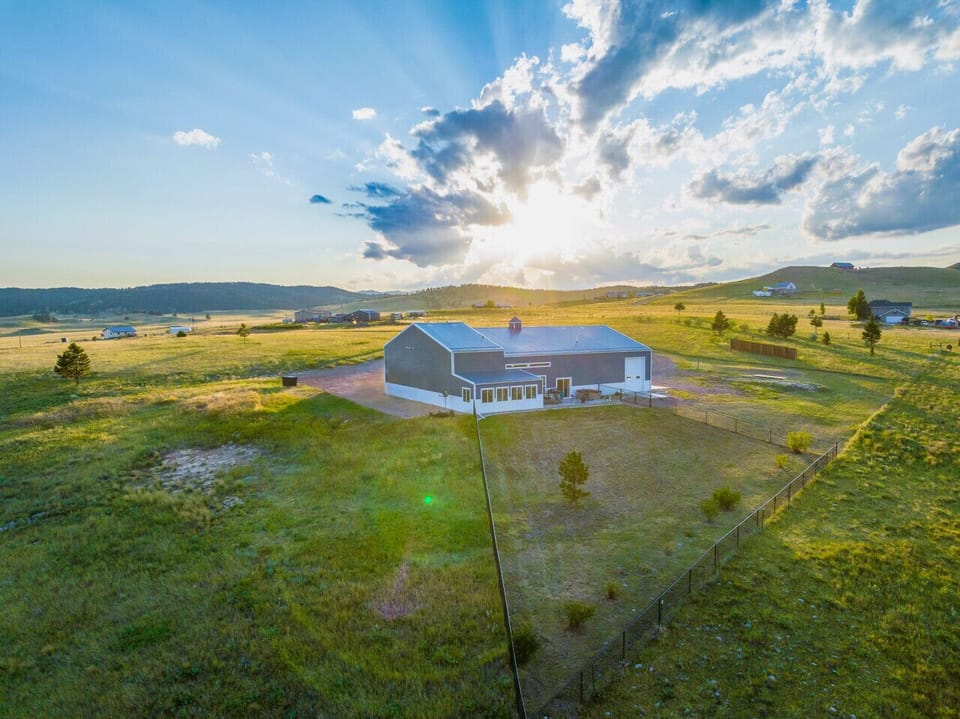 Set on 10 private acres, this retreat offers breathtaking panoramic views and stunning skies—beautiful both day and night!