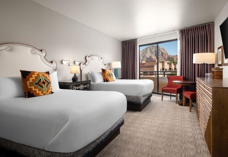 Stretch out in double-queen comfort with stunning mountain backdrop.
