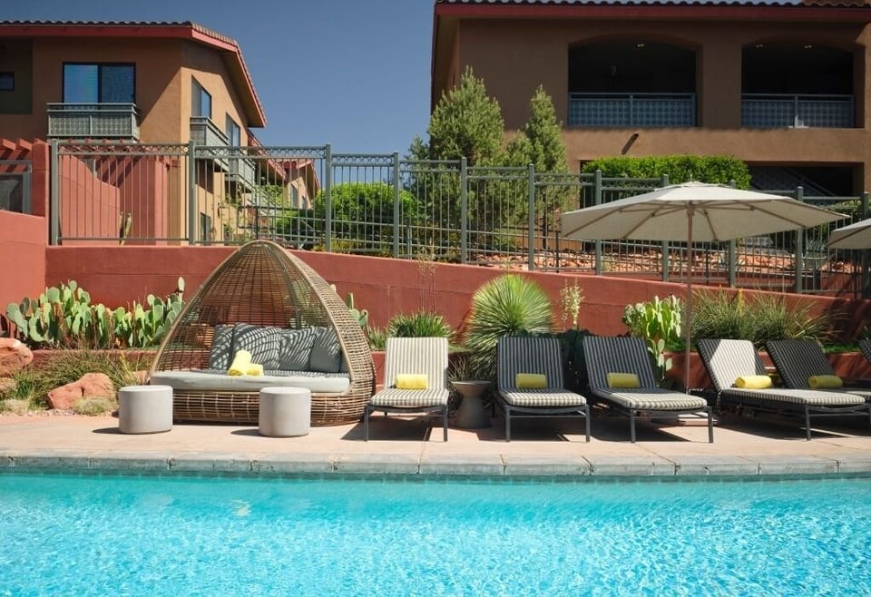 Unwind poolside on cushioned loungers under desert sunshine.