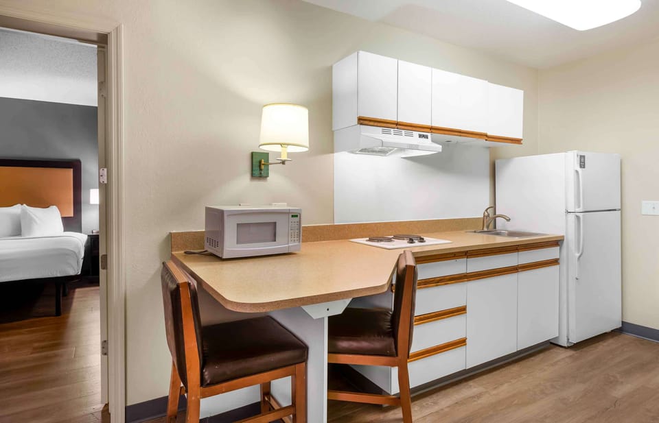 Suite, 1 King Bed with Sofa bed, Non Smoking | Private kitchen | Fridge, microwave, stovetop, coffee/tea maker