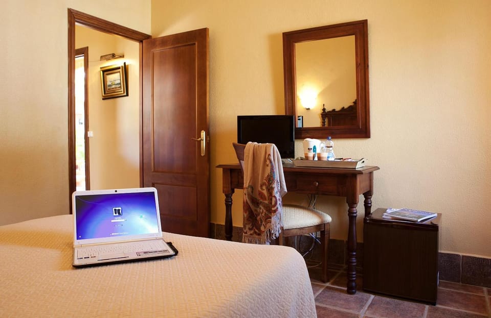 Desk, blackout drapes, bed sheets