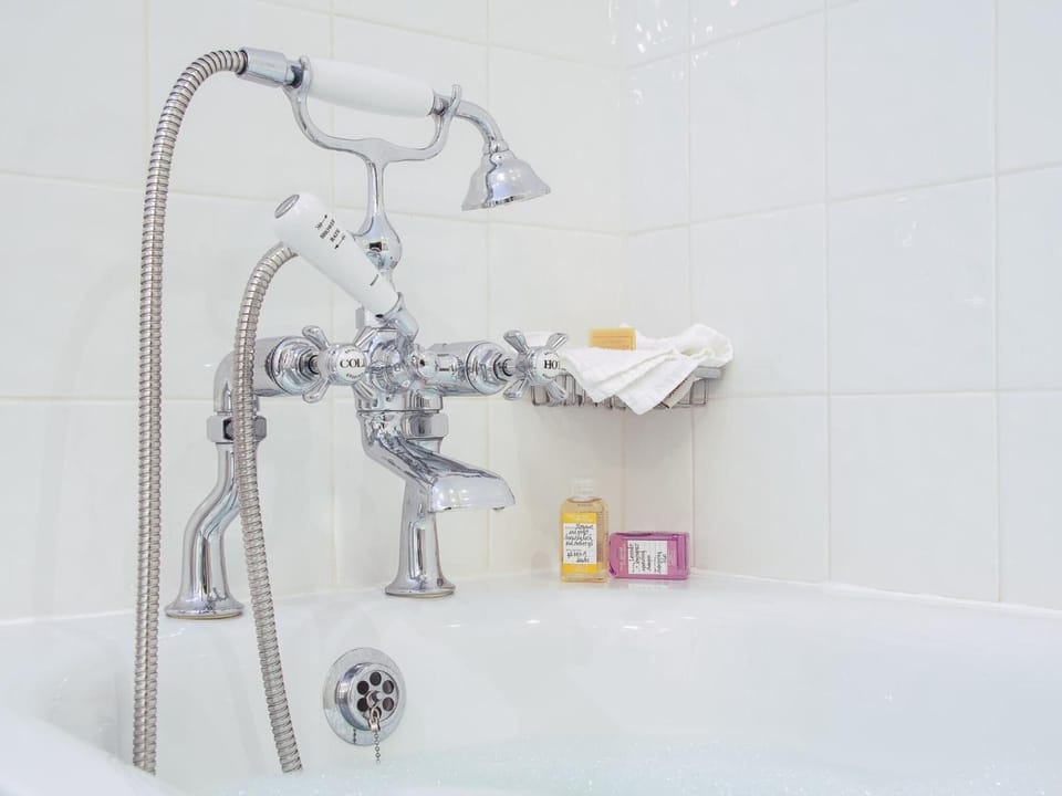 Separate tub and shower, designer toiletries, bidet, towels
