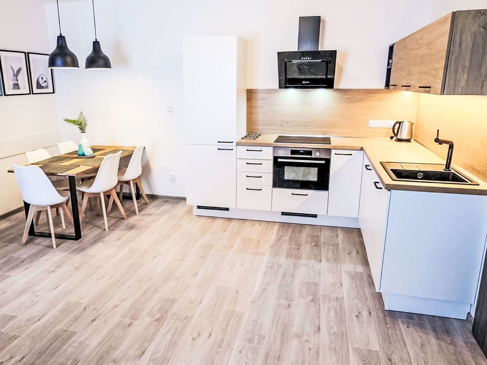 Flooring, Interior Design, Furniture, Wood Flooring, Floor, Wood, Laminate Flooring, Room, Countertop, Cabinetry