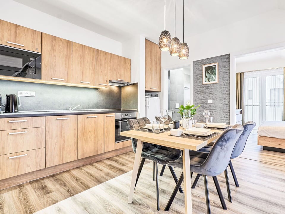 Furniture, Interior Design, Flooring, Wood, Floor, Wood Flooring, Room, Ceiling, Apartment, Cabinetry