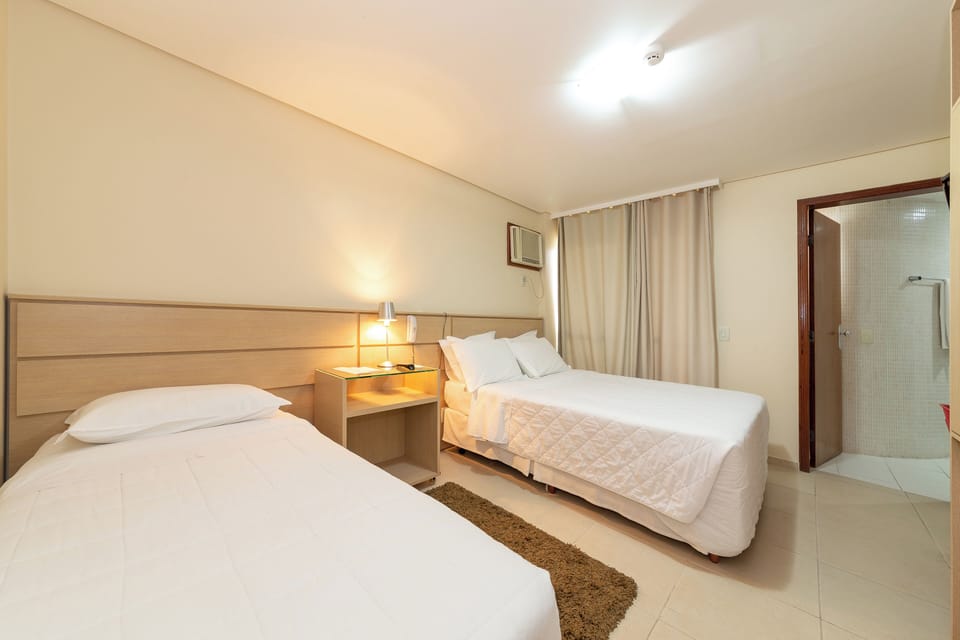 Family Room | Minibar, desk, blackout drapes, iron/ironing board