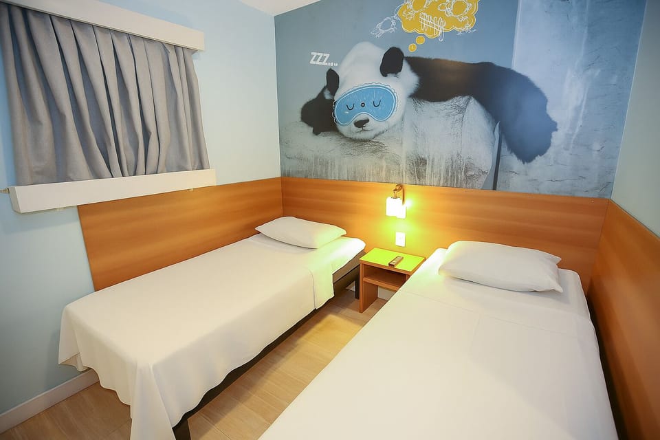 Twin Room, 2 Twin Beds | Minibar, desk, laptop workspace, blackout drapes
