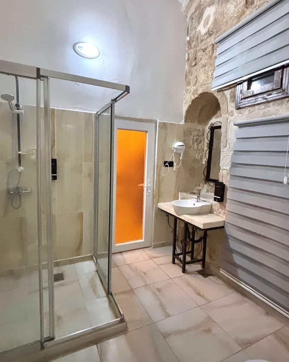 Shower, hair dryer, slippers, towels