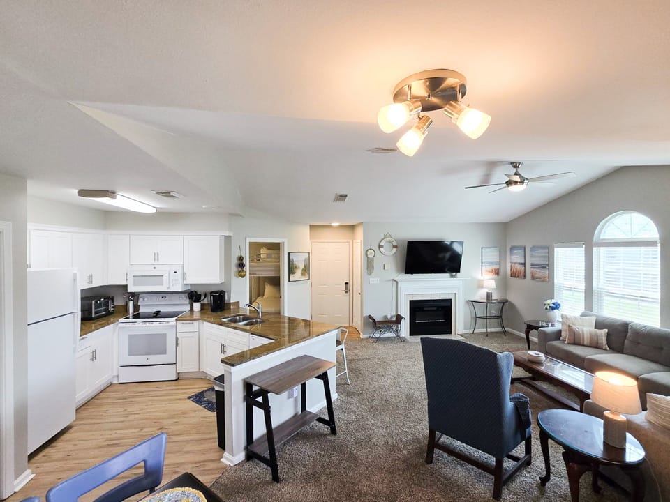 Apartment, Multiple Beds, Balcony, Garden View (Colony Club P3) | Living area | 42-inch flat-screen TV with digital channels, fireplace