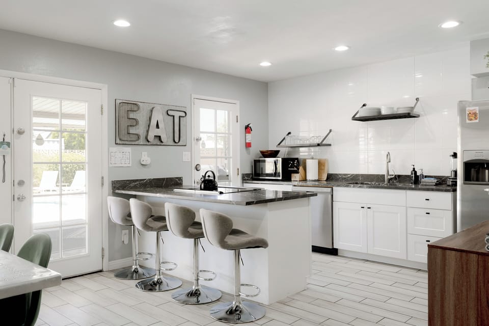 Fully stocked kitchen with coffee bar, filtered water and ice maker.