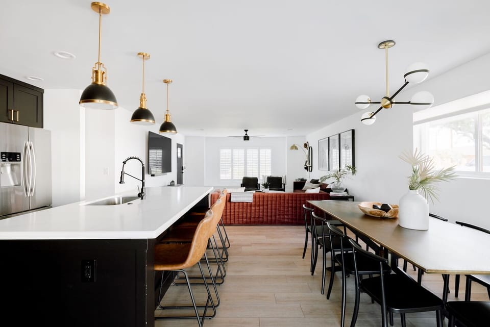 The open concept living area has a large dining table with seating for 10.