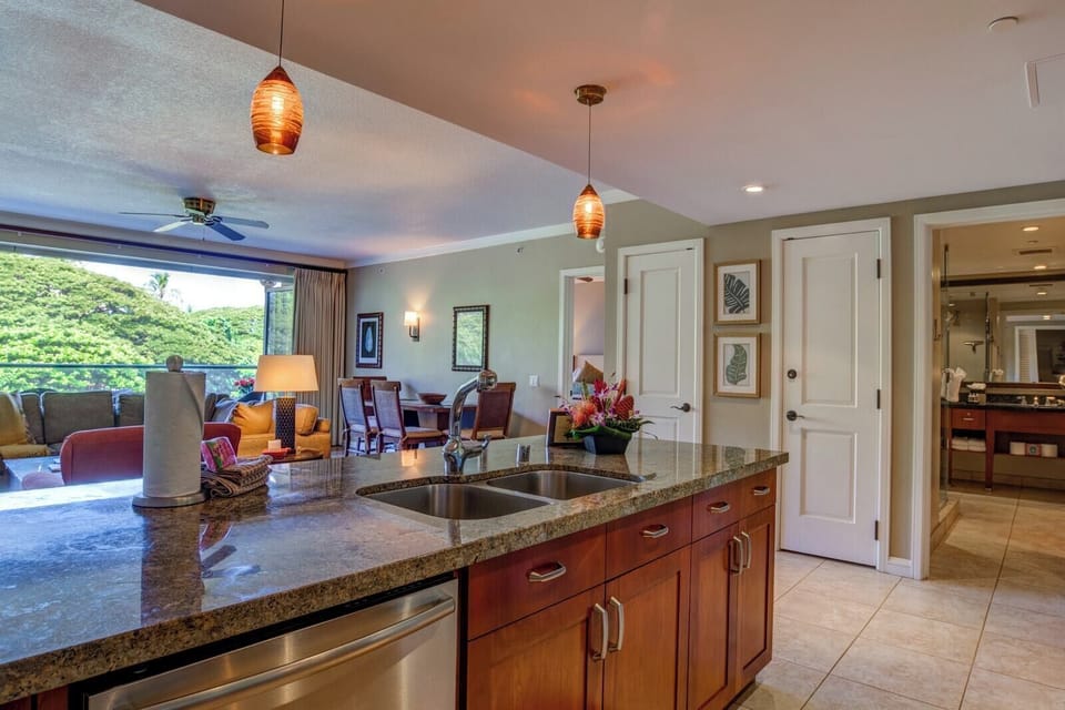 Modern kitchen island with open layout to living and dining areas. HKK-242