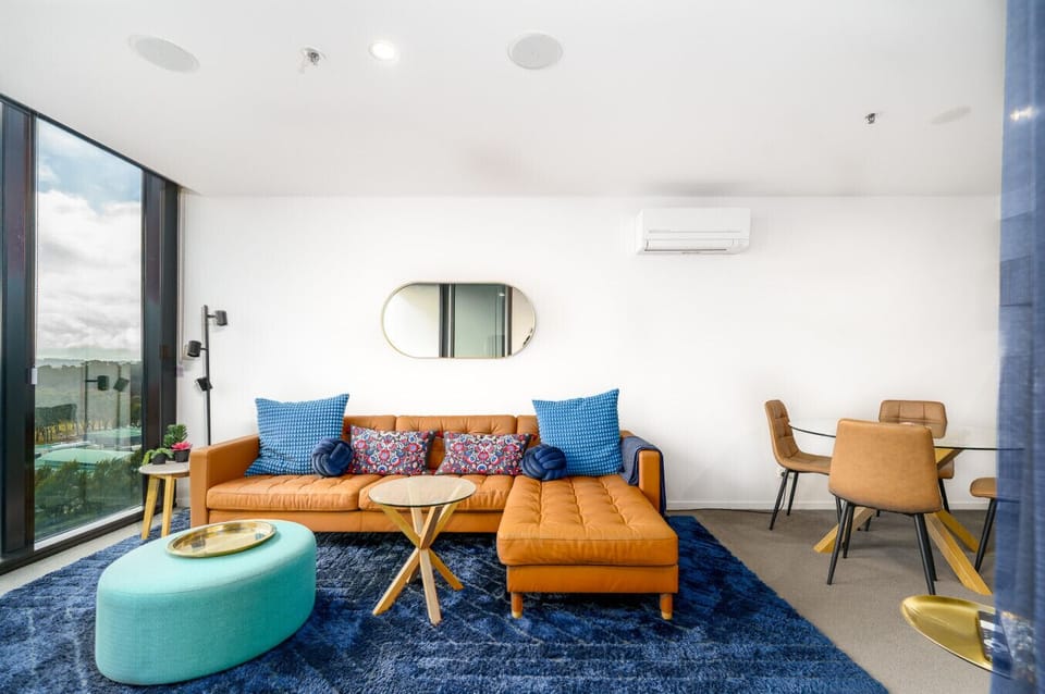 Relax in contemporary comfort, surrounded by vibrant textures in a spacious stylish living room.