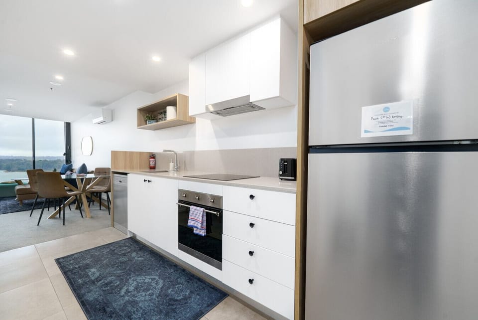 Where modern minimalism meets everyday comfort. This polished kitchen invites you to cook, sip, and linger in style