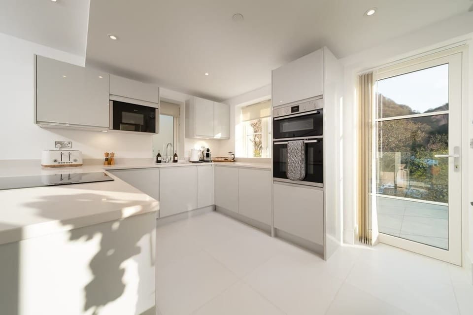 The open plan kitchen is fully equipped for everything you may need during your stay.