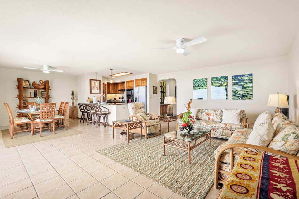 Spacious island-style living and dining - Open-concept living, dining, and kitchen area with tropical flair—perfect for gathering with family or friends after a day in paradise