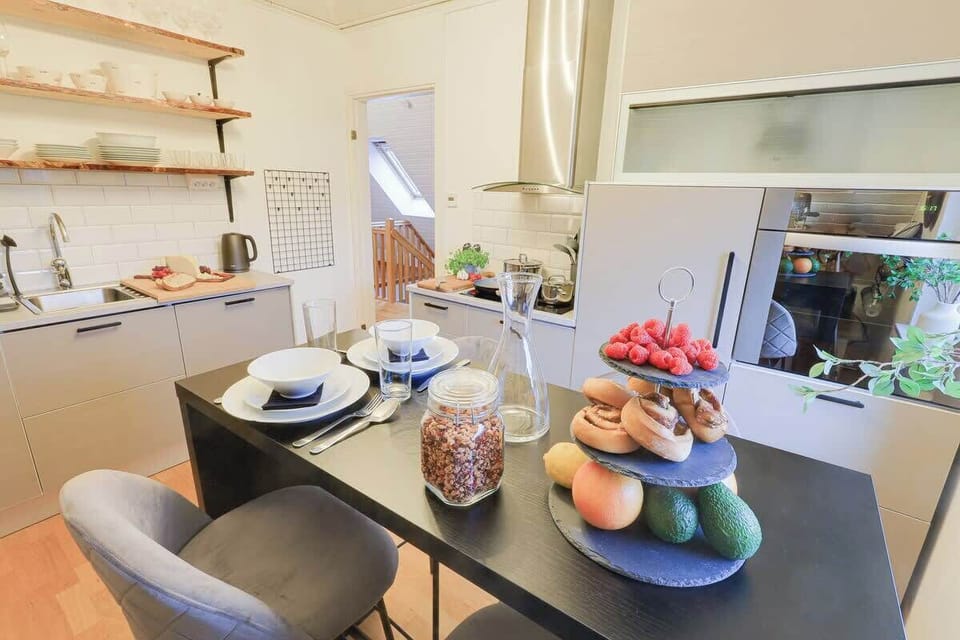 This is our well equipped kitchen where you can cook home made meals, have quick meals or just breakfast. We have some open shelving solution for easy find in the kitchen, oven and microwave amongst other kitchen appliances. 