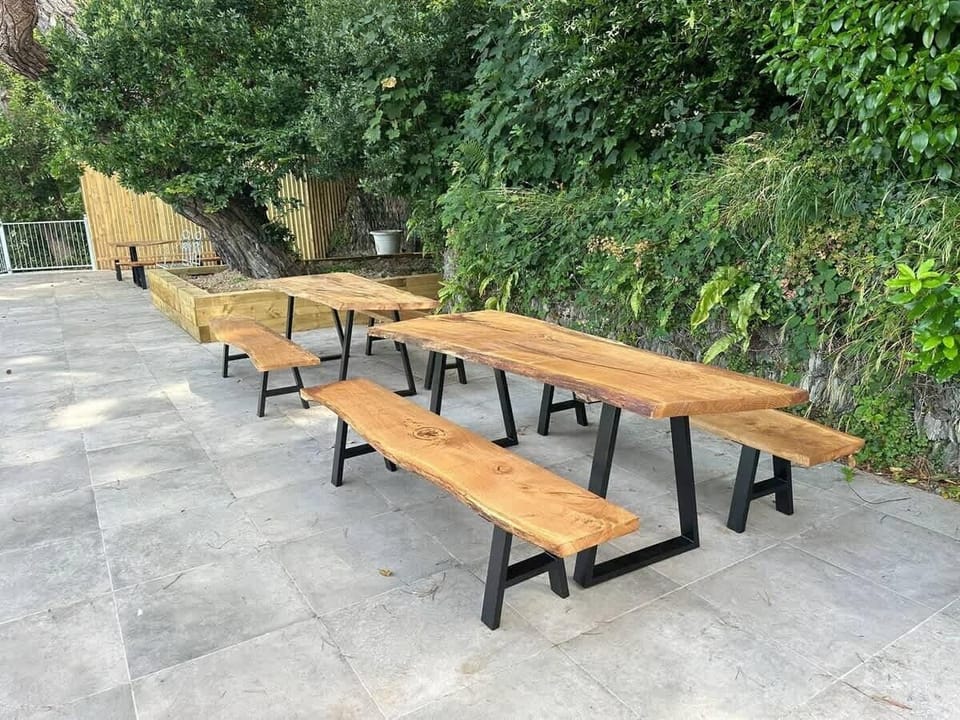 Shared terrace area, perfect for a BBQ. Disposable barbecues are available for purchase through the guest app.