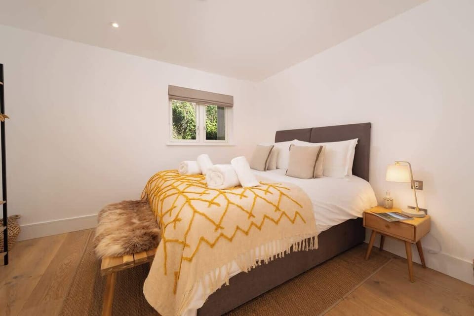 Wake up in your stunning, modern bedroom, where every morning feels like a peaceful escape into nature.