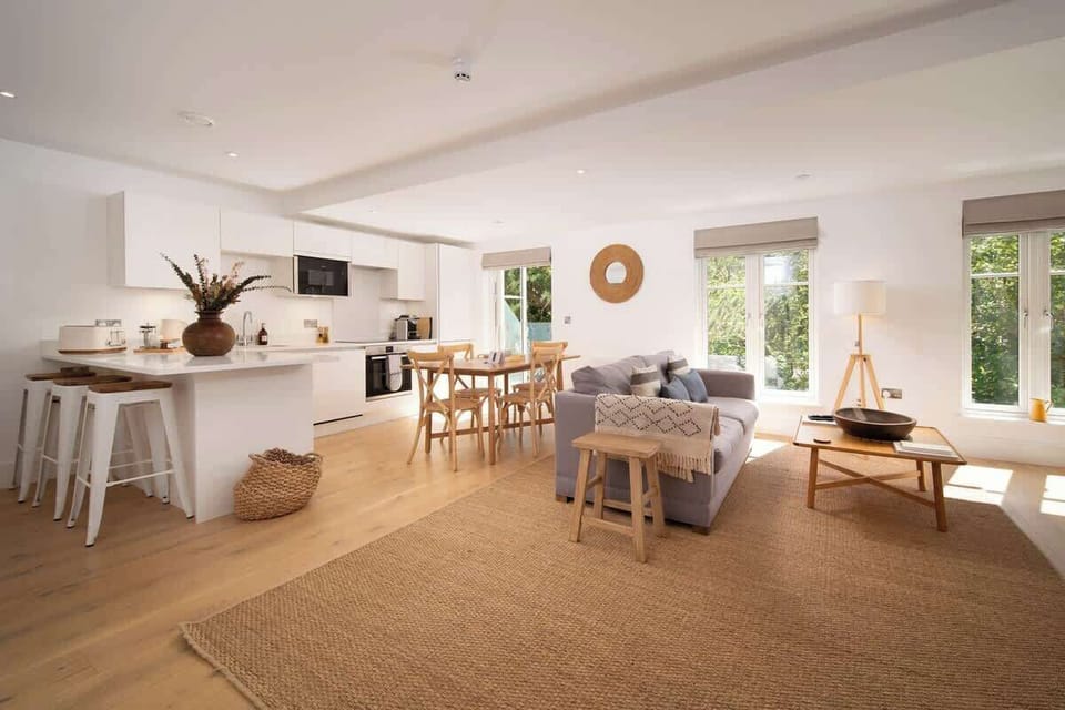 Relax in the stylish living room, where breathtaking valley views create a serene and picturesque setting.