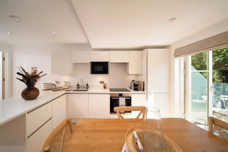 The streamlined kitchen comes fully equipped with everything you need for your stay.