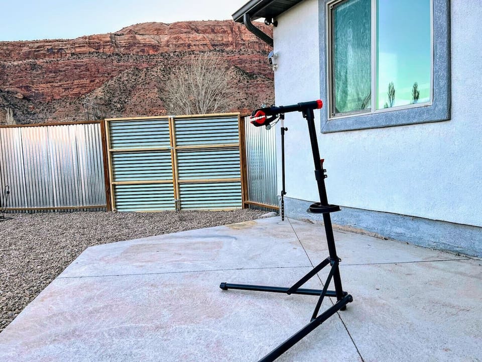 Wash or repair your bike after tackling Slickrock, or rinse and dry your gear after a great day of adventure (hooks on the fence for drying)