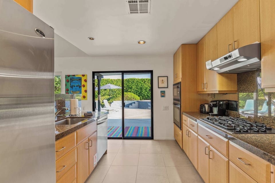 Fully equipped kitchen & poolside access. 